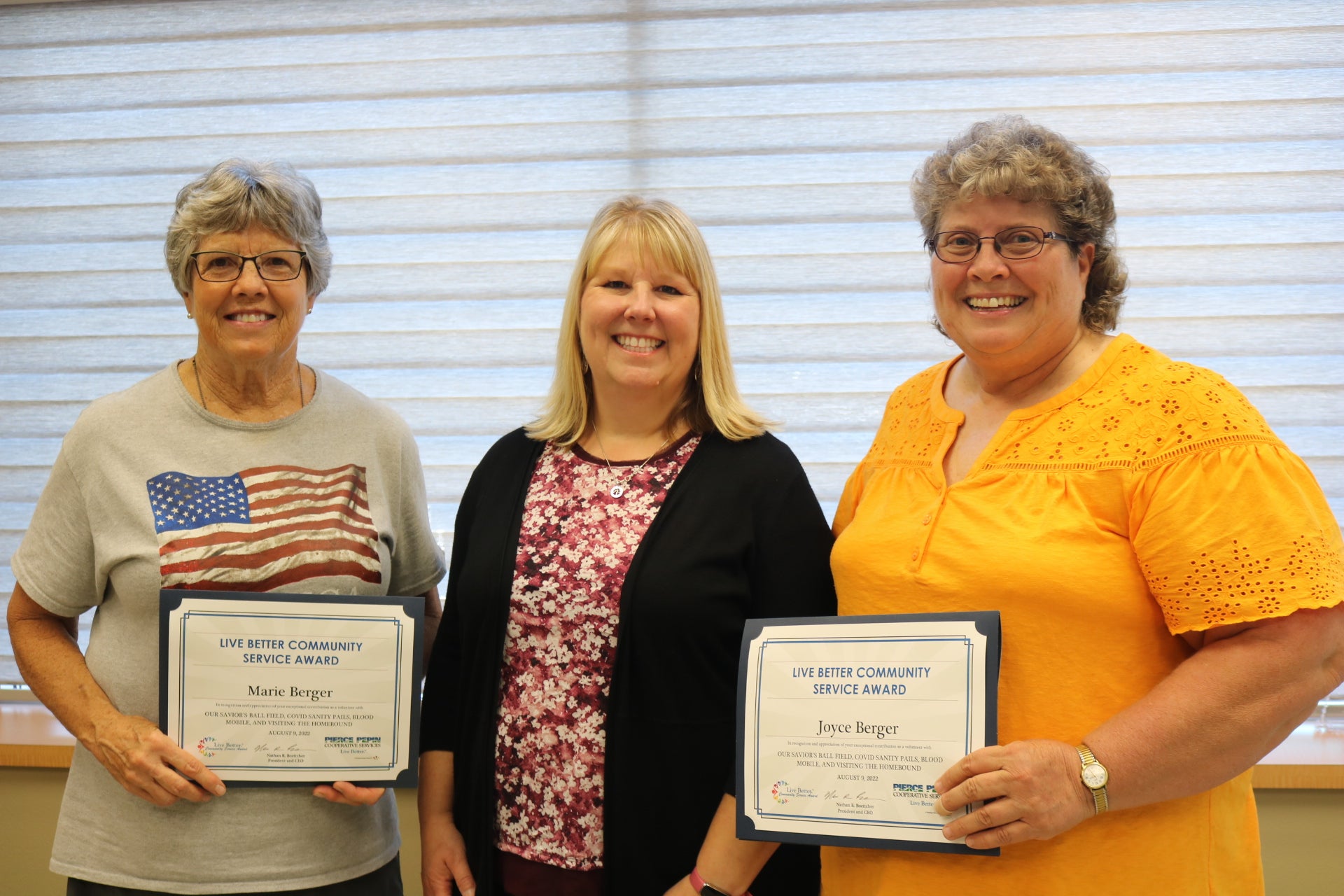 Charity Lubich (center) presented the Live Better Award to the Berger sisters