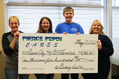 Gina Klecker, Deanna Hines and Sam Hines receive check.